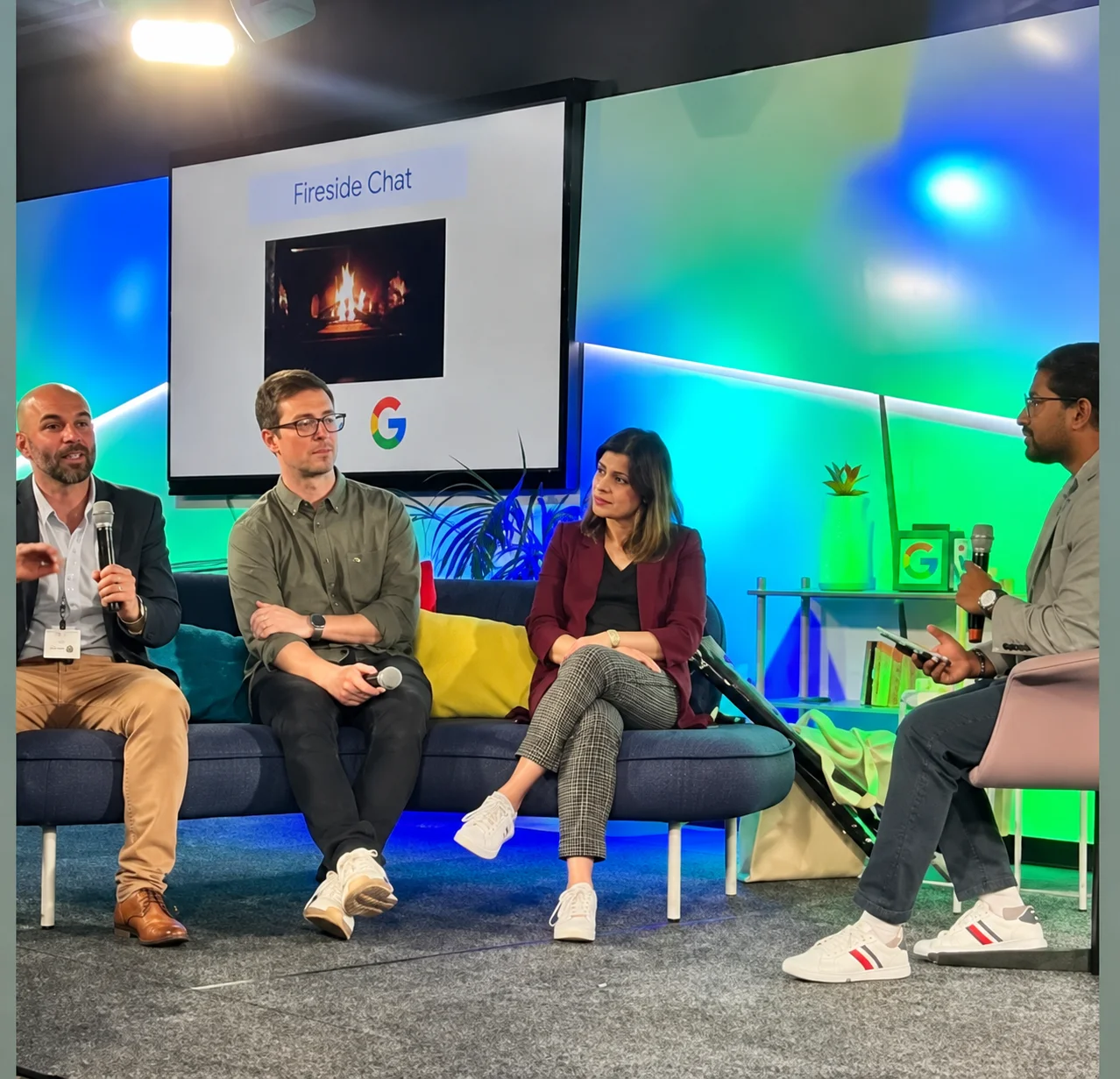 A fireside chat panel discussion taking place at a digital marketing industry event.